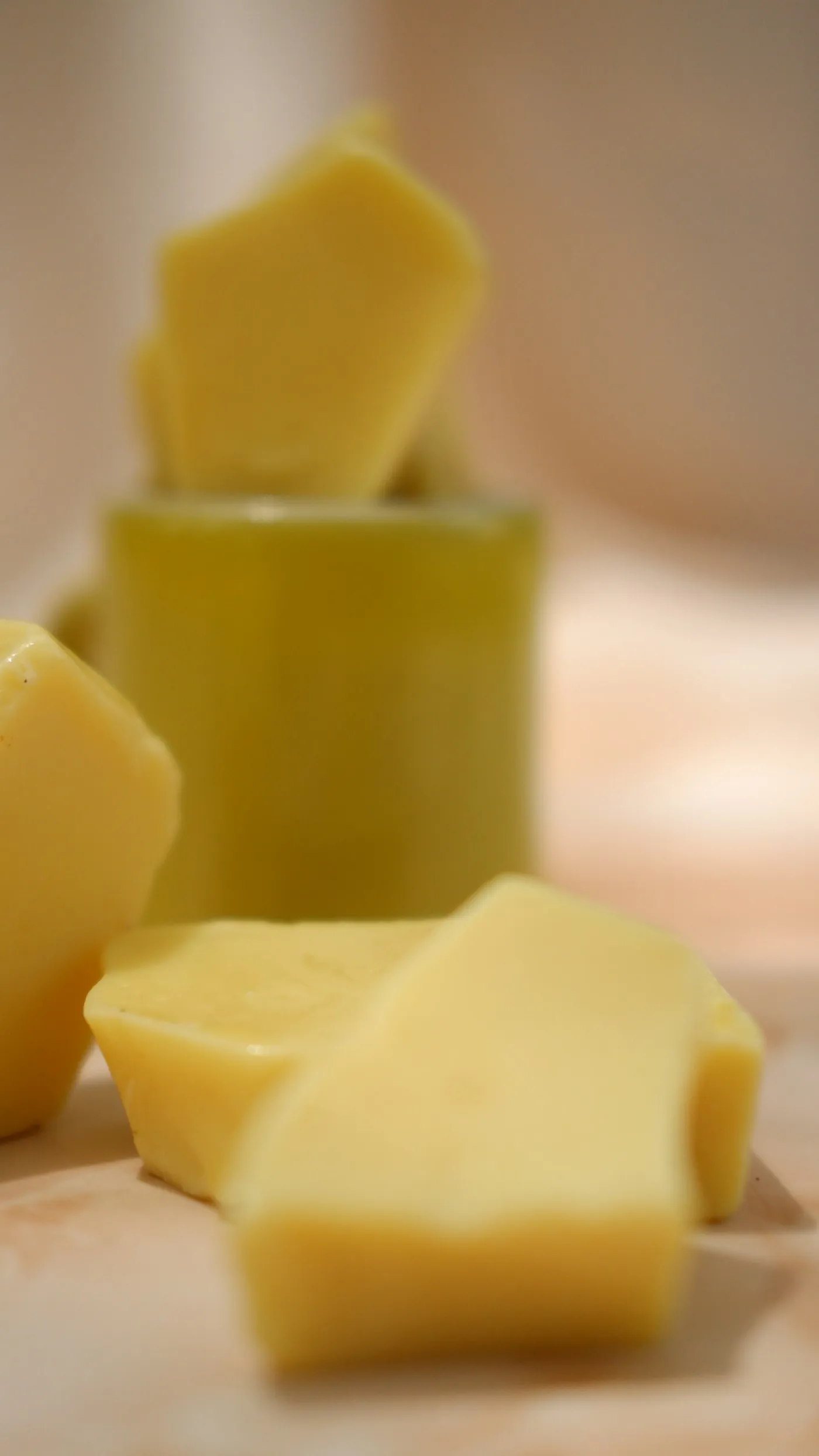 Ivory-yellow blocks of natural cocoa butter